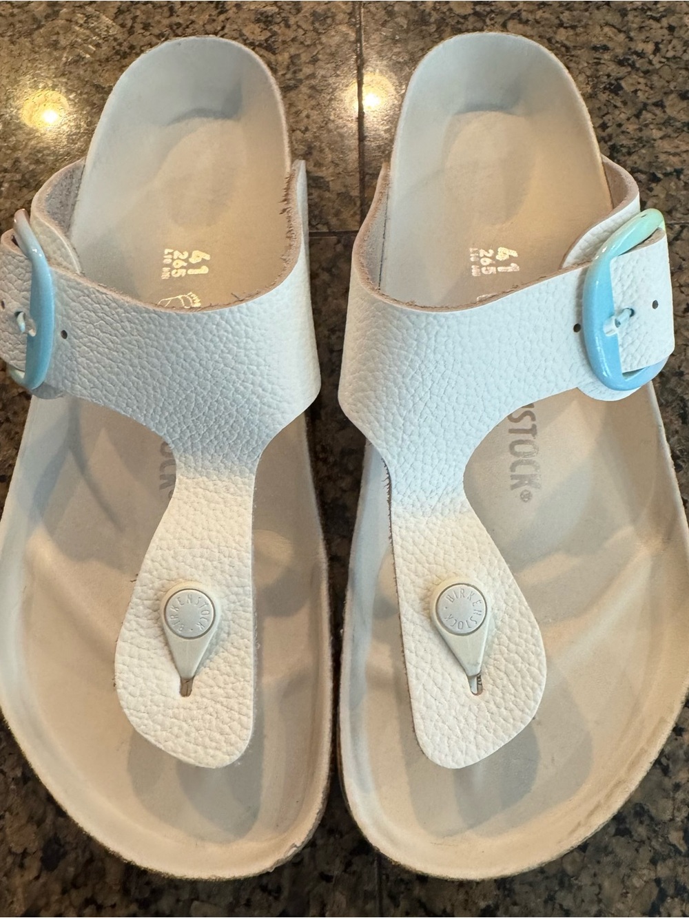 Birkenstock White T-Strap Sandals with Light Blue Buckle